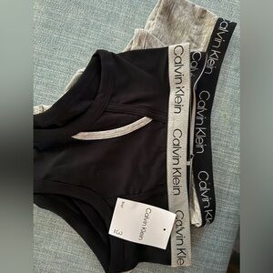 Three pairs of size med calvim klein cotton panties 
Two grey. One black